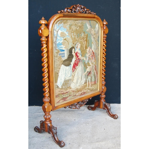 316 - Victorian walnut framed firescreen mounted by pierced scroll work, moulded rounded rectangular frame... 