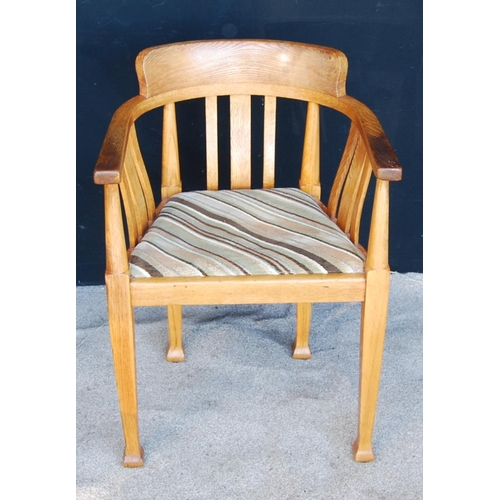 322 - Edwardian oak tub chair with stepped top rail, hoop arms, shaped vertical splats over drop-in pad se... 