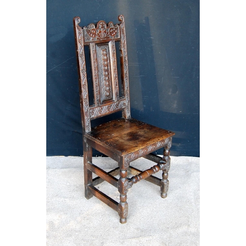 323 - 18th century oak hall chair, the floral carved top rail over vertical splat, moulded seat and raised... 