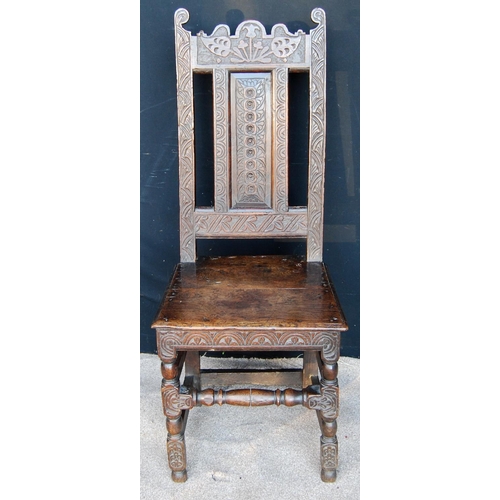 323 - 18th century oak hall chair, the floral carved top rail over vertical splat, moulded seat and raised... 