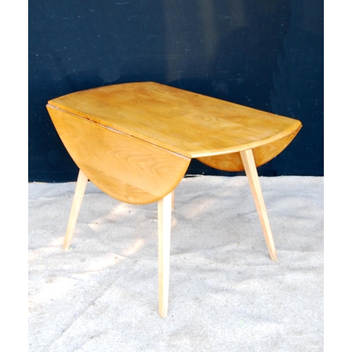 325 - Ercol drop-flap table with oval top, raised on splayed tapering square legs, 113cm wide, 71cm high a... 