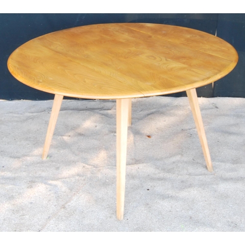 325 - Ercol drop-flap table with oval top, raised on splayed tapering square legs, 113cm wide, 71cm high a... 