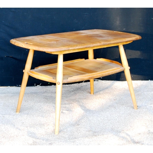 329 - Ercol coffee table with rounded rectangular top, pierced handles, raised on splayed turned legs unit... 