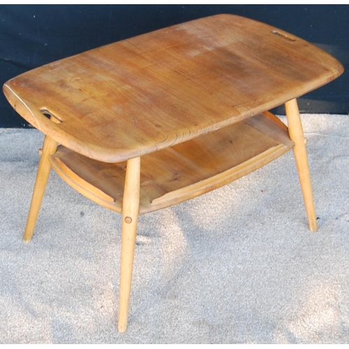 329 - Ercol coffee table with rounded rectangular top, pierced handles, raised on splayed turned legs unit... 