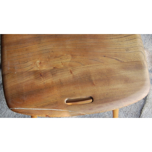 329 - Ercol coffee table with rounded rectangular top, pierced handles, raised on splayed turned legs unit... 