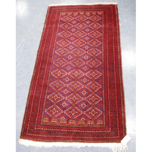 334 - Kurdish rug with all over diamond design, red ground and multiple border, 186cm x 97cm.