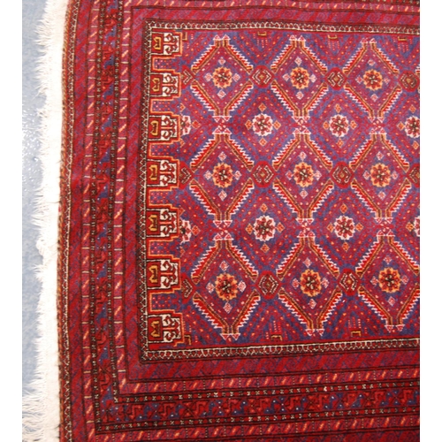 334 - Kurdish rug with all over diamond design, red ground and multiple border, 186cm x 97cm.