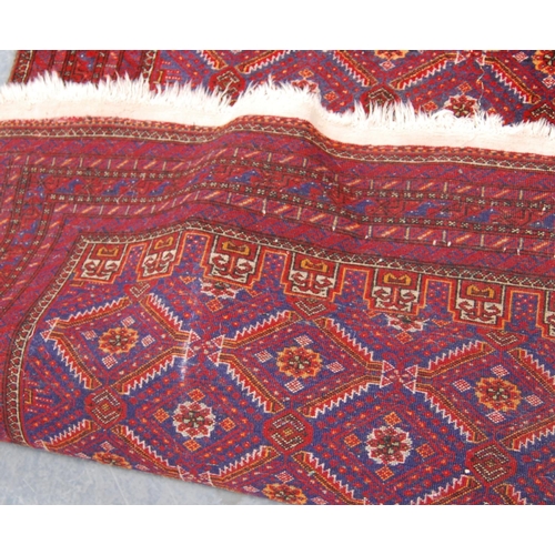 334 - Kurdish rug with all over diamond design, red ground and multiple border, 186cm x 97cm.