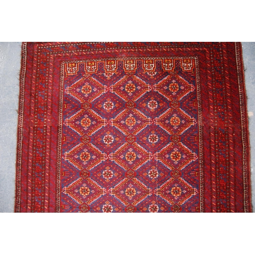 334 - Kurdish rug with all over diamond design, red ground and multiple border, 186cm x 97cm.