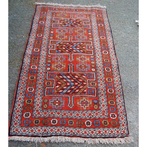 335 - Kurdish Quchan rug with three H panels with arrows over orange ground, all over guls and rosettes, 2... 