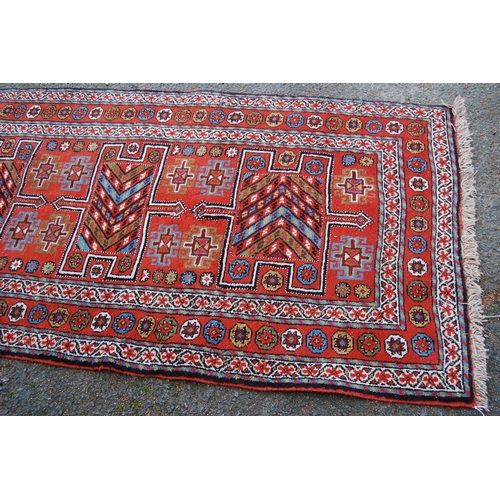 335 - Kurdish Quchan rug with three H panels with arrows over orange ground, all over guls and rosettes, 2... 