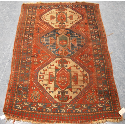 341 - Kazak rug with triple medallions over red ground and star border, 202cm x 132cm.