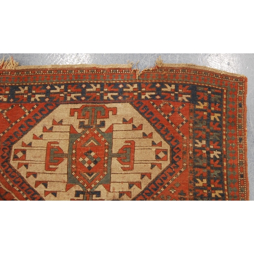 341 - Kazak rug with triple medallions over red ground and star border, 202cm x 132cm.