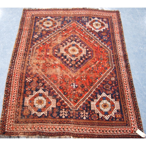 343 - Kashgar rug with central rosette and diamond star spandrels and border, 197cm x 158cm.