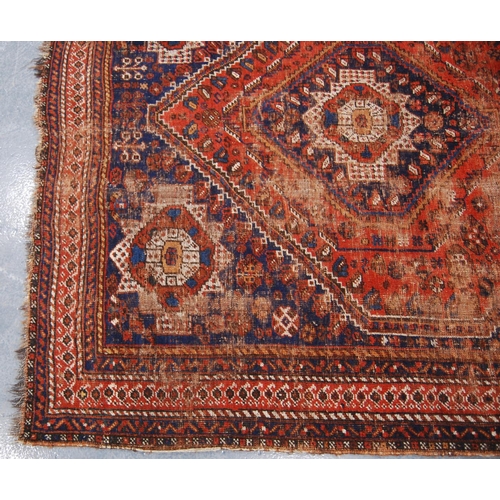 343 - Kashgar rug with central rosette and diamond star spandrels and border, 197cm x 158cm.