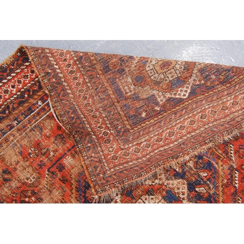 343 - Kashgar rug with central rosette and diamond star spandrels and border, 197cm x 158cm.