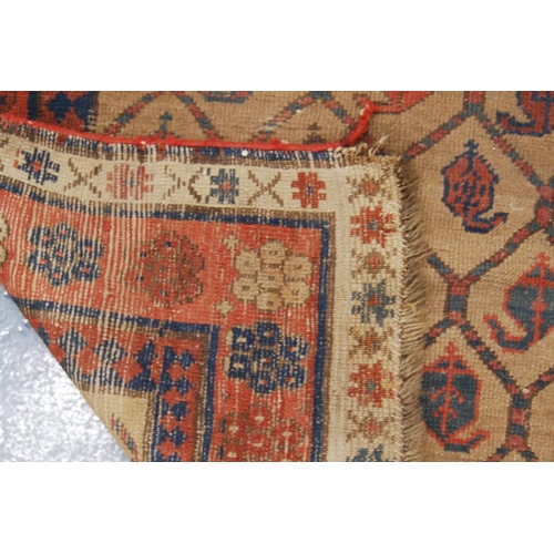 346 - Talish rug, c. 1850, with lattice work field, beige ground and triple border, 203cm x 95cm.