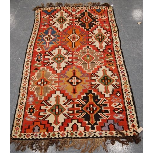 347 - Shirvan Kilim with star design over faded red ground and diamond border, 300cm x 167cm.