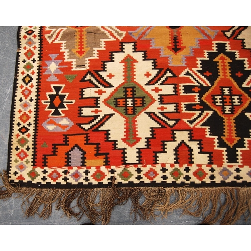 347 - Shirvan Kilim with star design over faded red ground and diamond border, 300cm x 167cm.