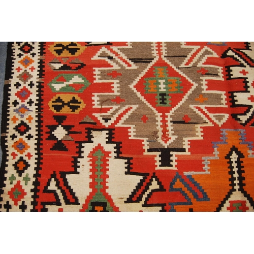 347 - Shirvan Kilim with star design over faded red ground and diamond border, 300cm x 167cm.