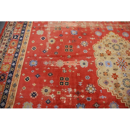 350 - Large Persian carpet with central medallion over pink ground with assorted motifs, spandrels and flo... 
