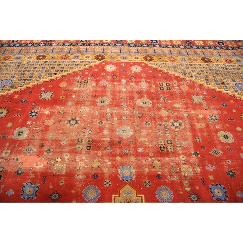 350 - Large Persian carpet with central medallion over pink ground with assorted motifs, spandrels and flo... 