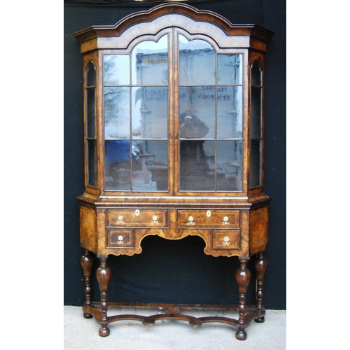 359 - Dutch walnut display cabinet on stand, the arched moulded cornice over glazed doors and canted panel... 