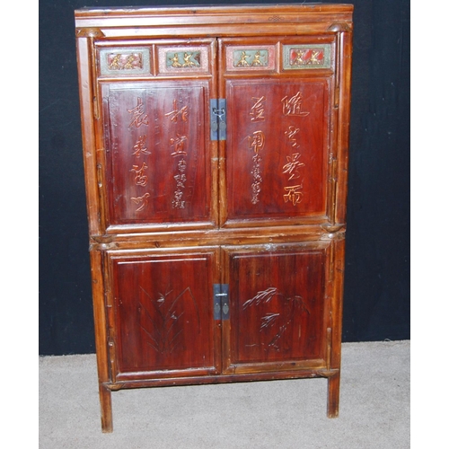 368 - Chinese cabinet on stand of rectangular form with carved panelled doors, raised on block feet, 104cm... 