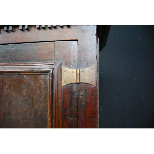 384 - Georgian oak hall cabinet, the projected moulded cornice over panelled doors over stepped base with ... 