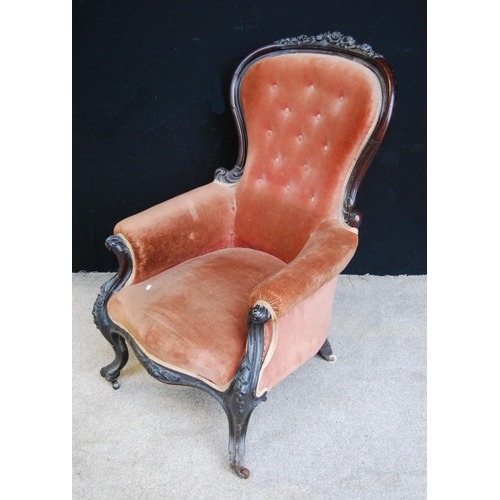 386 - Victorian button-back armchair with floral carved frame, cushioned arms and seat, raised on cabriole... 