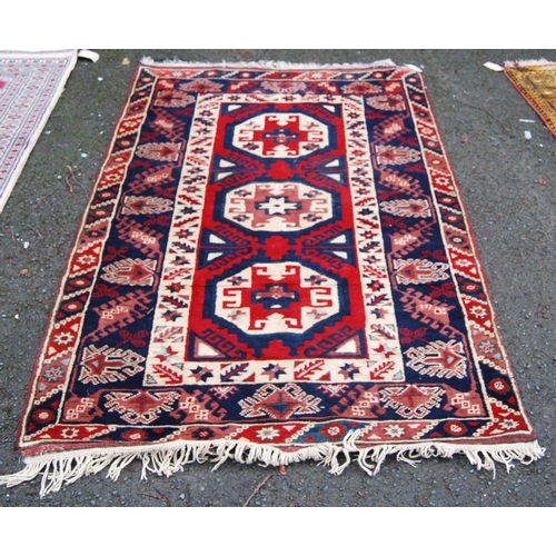 393 - Turkish rug with three cruciform octagonal panels, star and floral triple border, 120cm x 93cm.