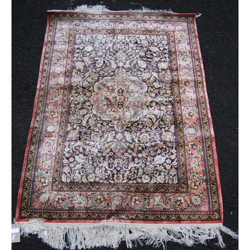 395 - Persian silk rug with central floral medallion, all over floral pattern and borders, 155cm x 108cm.