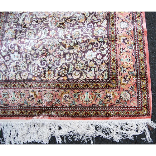 395 - Persian silk rug with central floral medallion, all over floral pattern and borders, 155cm x 108cm.