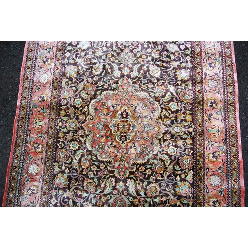 395 - Persian silk rug with central floral medallion, all over floral pattern and borders, 155cm x 108cm.