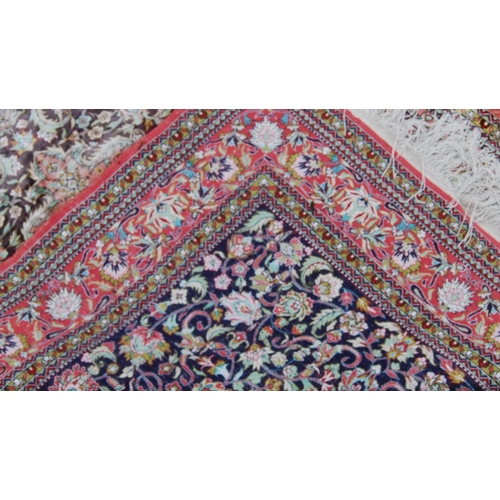 395 - Persian silk rug with central floral medallion, all over floral pattern and borders, 155cm x 108cm.