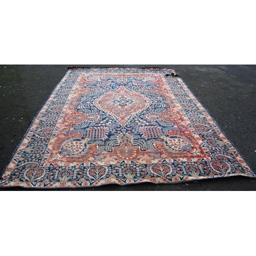 396 - Meshed carpet with central medallion over blue ground, all over floral design, spandrels and triple ... 