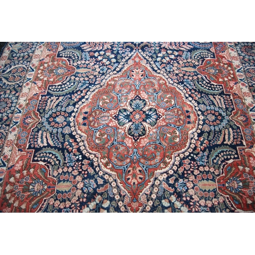 396 - Meshed carpet with central medallion over blue ground, all over floral design, spandrels and triple ... 