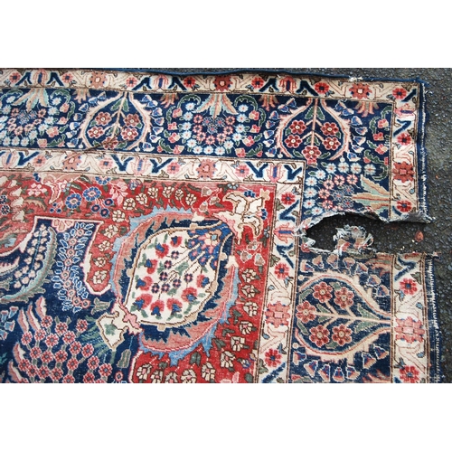 396 - Meshed carpet with central medallion over blue ground, all over floral design, spandrels and triple ... 