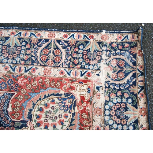 396 - Meshed carpet with central medallion over blue ground, all over floral design, spandrels and triple ... 