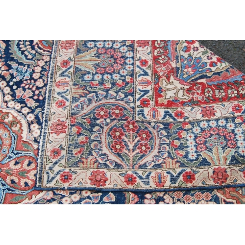 396 - Meshed carpet with central medallion over blue ground, all over floral design, spandrels and triple ... 