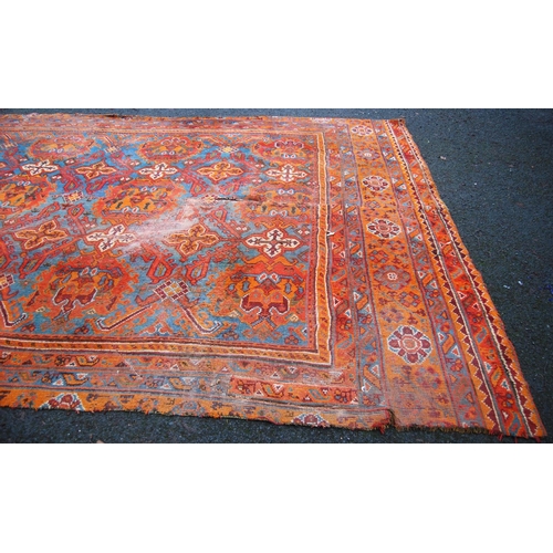 397 - Turkoman carpet with three rows of four medallions over blue ground, two rows of seven cruciforms, o... 