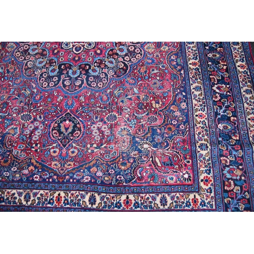 398 - Meshed carpet with all over floral design, central rosette, spandrels, blue and cream border, 338cm ... 