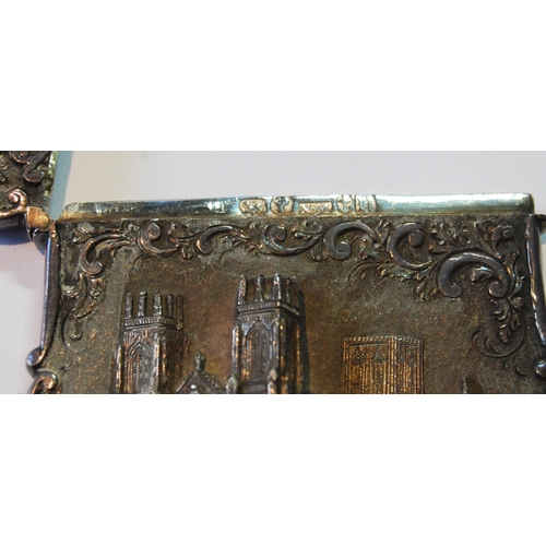 50 - Silver 'castle top' card case with a view of York Minster in high relief amongst scrolls by Nathanie... 