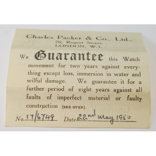 59 - Lady's Juvenia stainless steel watch on cordette, case tag, guarantee and receipt, 1950.