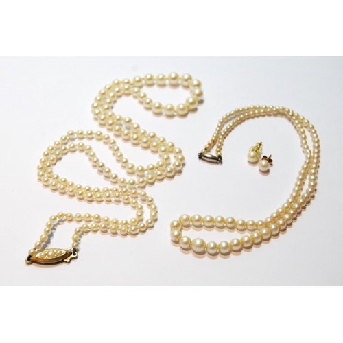 64 - Two graduated cultured pearl necklets on gold snaps, and a pair of similar ear studs.