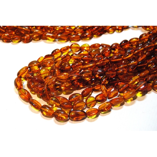 68 - Butterscotch amber necklace of seven strands on silver snap, gross 181g, snap approximately 60g.