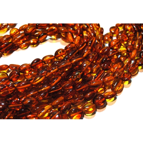 68 - Butterscotch amber necklace of seven strands on silver snap, gross 181g, snap approximately 60g.