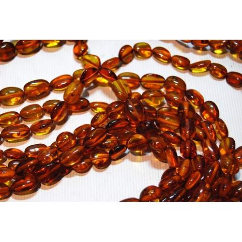 68 - Butterscotch amber necklace of seven strands on silver snap, gross 181g, snap approximately 60g.