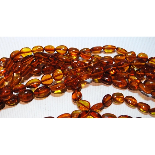 68 - Butterscotch amber necklace of seven strands on silver snap, gross 181g, snap approximately 60g.