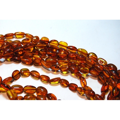 68 - Butterscotch amber necklace of seven strands on silver snap, gross 181g, snap approximately 60g.